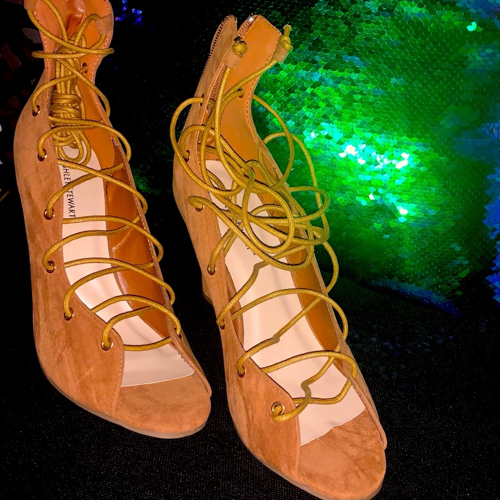 A pair of lace up wedge heels.